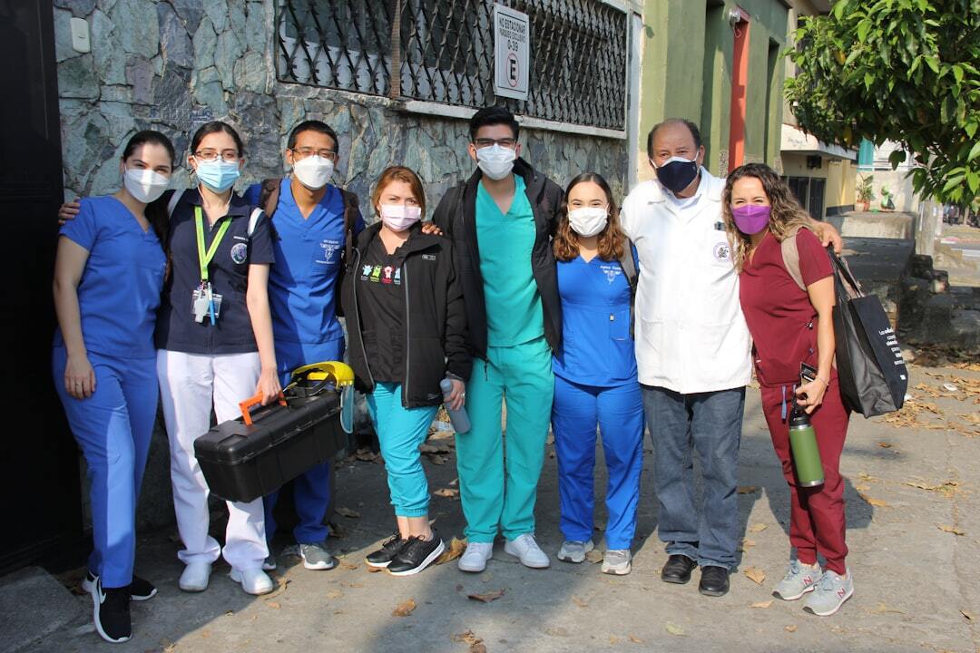 medical professionals in masks outside